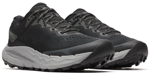 A pair of low-top running shoes with black upper, speckled laces, and thick gray soles with knobby treads.