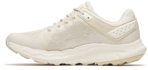 Beige athletic shoe with a mesh upper and thick white sole.