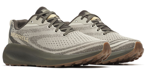 Low profile athletic shoes in shades of gray, with dark sole and brown tread.