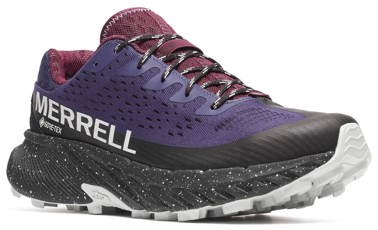 Purple running shoe with a black sole, white tread and speckled midsole with the word MERRELL and GORE-TEX printed on the side.