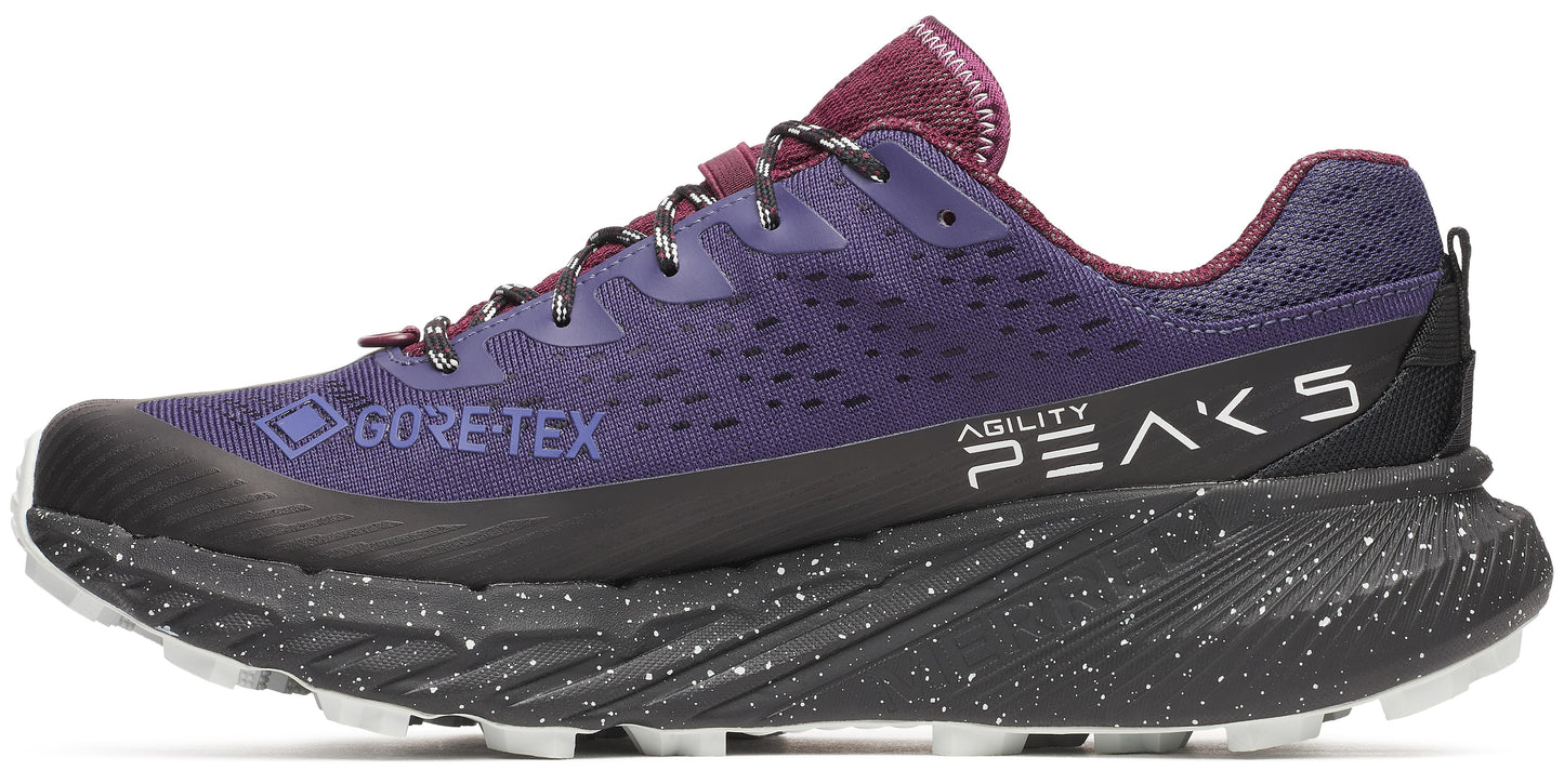 Trail running shoe, purple with black sole, with the text 'GORE-TEX' and 'AGILITY PEAKS 5' printed on it.
