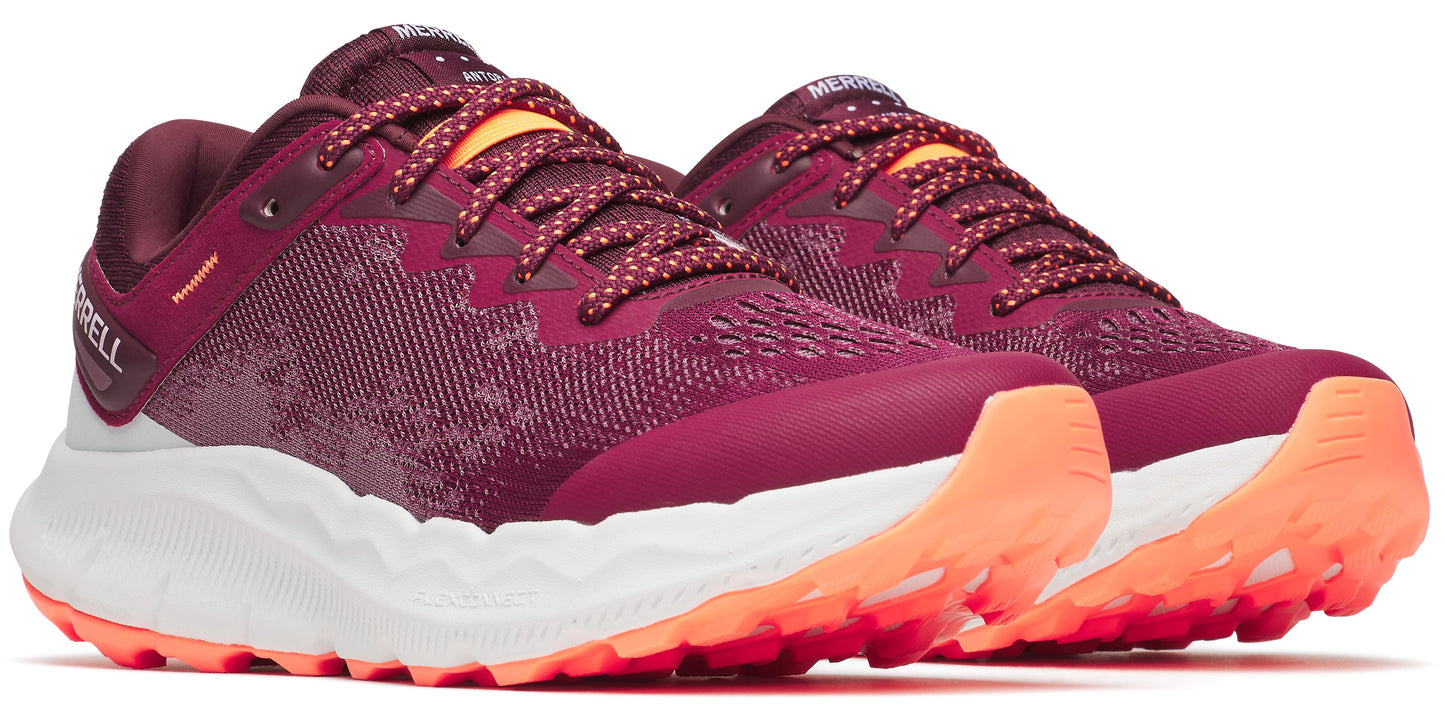 Two burgundy running shoes with white and orange soles and dotted laces.