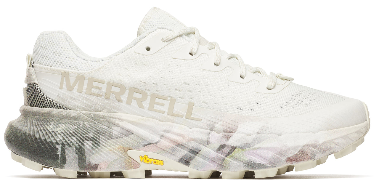 A white trail running shoe with the word MERRELL on its side.