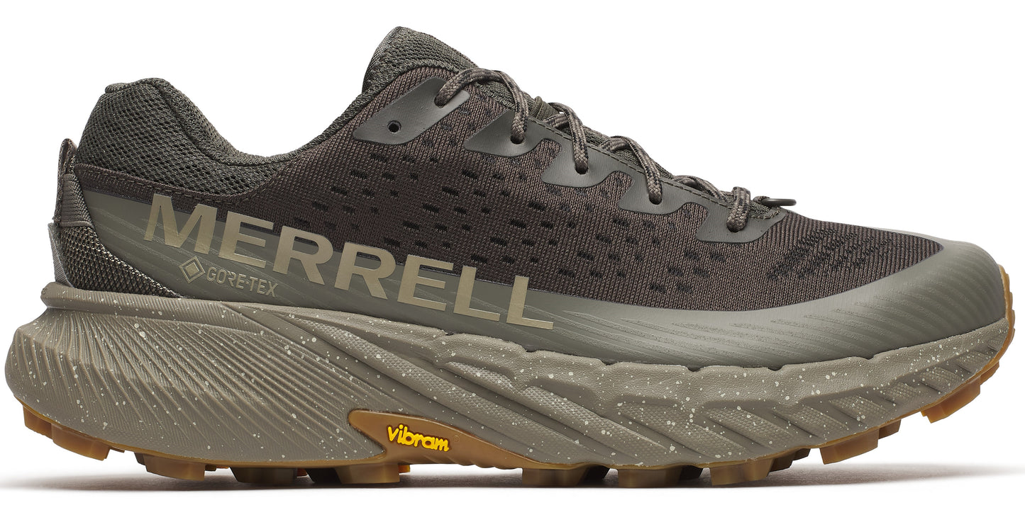 A hiking shoe in dark green with the word MERRELL printed on the side.