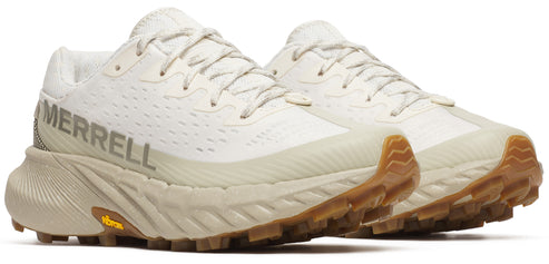Two low-top, off-white running shoes with the word MERRELL on the side and a lug sole.