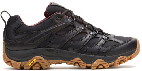 A black hiking shoe with a brown Vibram sole.
