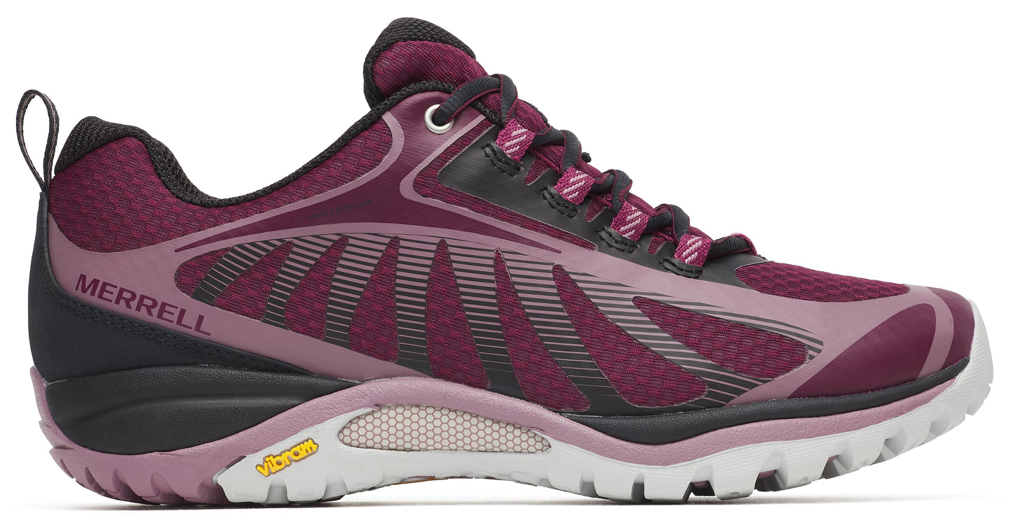 Side view of a women's hiking shoe in dark maroon with a black heel, laces, and collar, featuring a light gray sole with a small yellow Vibram logo.