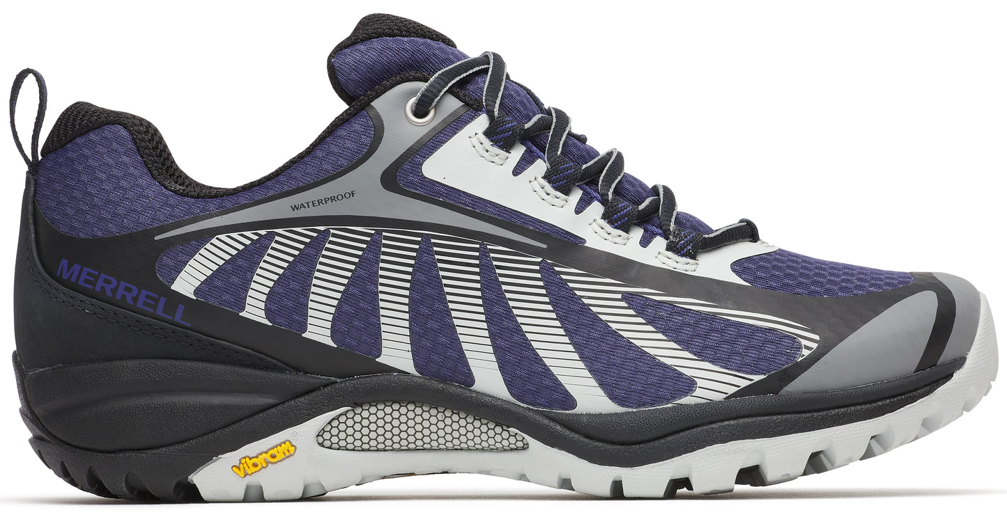 Side view of a low-cut waterproof hiking shoe with a dark blue, white, and grey upper, black heel and lugged sole, and "MERRELL" written on the heel.