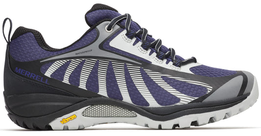 Side view of a low-cut waterproof hiking shoe with a dark blue, white, and grey upper, black heel and lugged sole, and 