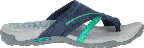 A navy and green thong sandal on a gray sole.