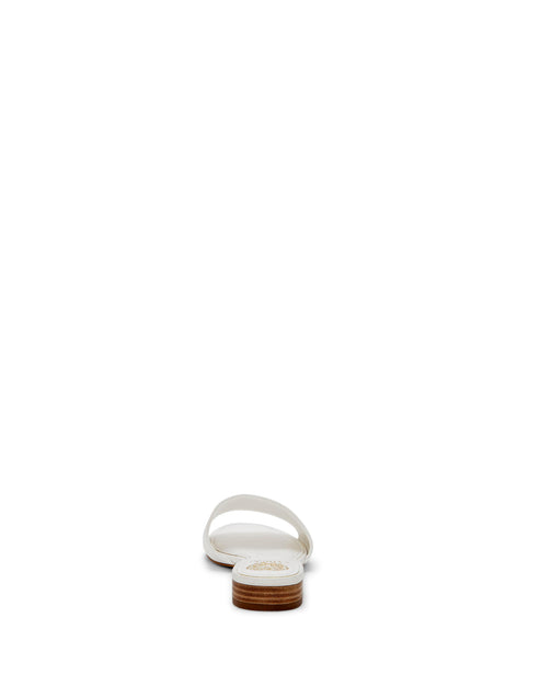 White sandal featuring a simple, flat design with a single strap over the toes and a low heel.