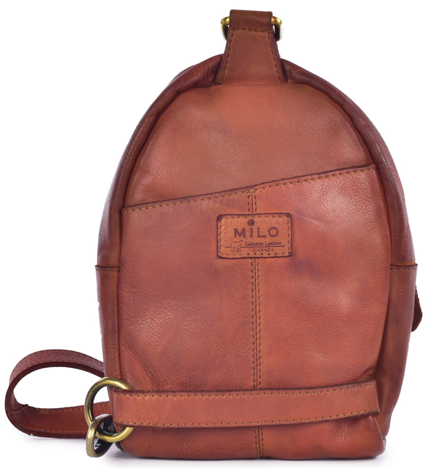 A tan leather, rounded-top crossbody sling bag with a vertical seam, a horizontal strap near the bottom, brass hardware, and a small rectangular logo patch on the front center that reads MILO Genuine Leather CANADA.
