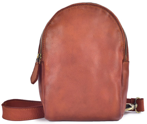 A small, rounded, light brown leather crossbody bag featuring a vertical zippered main compartment, a matching leather strap, and brushed metal hardware.