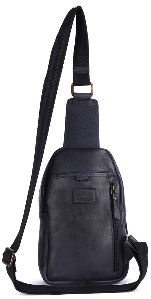 A black leather crossbody sling bag with a vertical front zipper pocket, an adjustable strap, and a logo patch on the front.