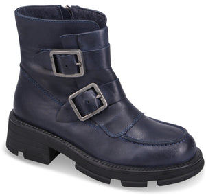 Navy blue, ankle-high leather boot with block heel and two decorative buckled straps.