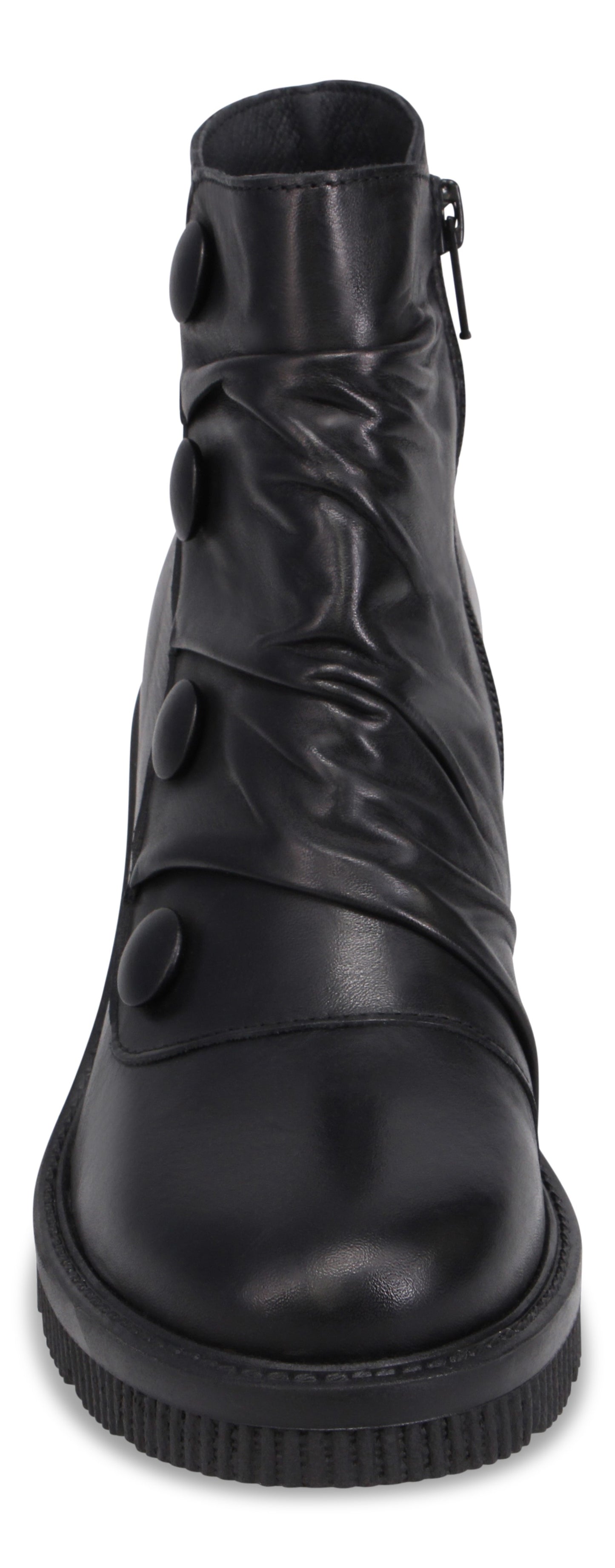 A black ankle boot with a rounded toe, a thick ridged lug sole, and a decorative strap on the side adorned with four black circular buttons, featuring a zippered closure on the inner side.