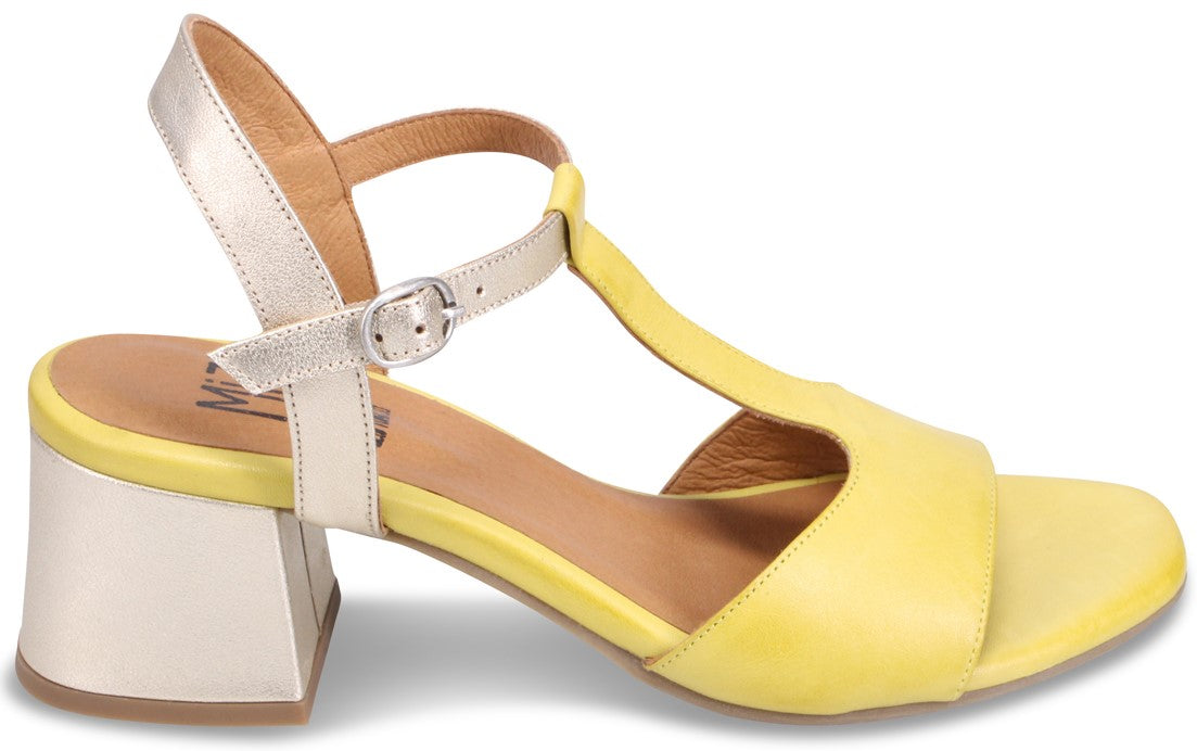 Yellow sandal with silver block heel and ankle strap.