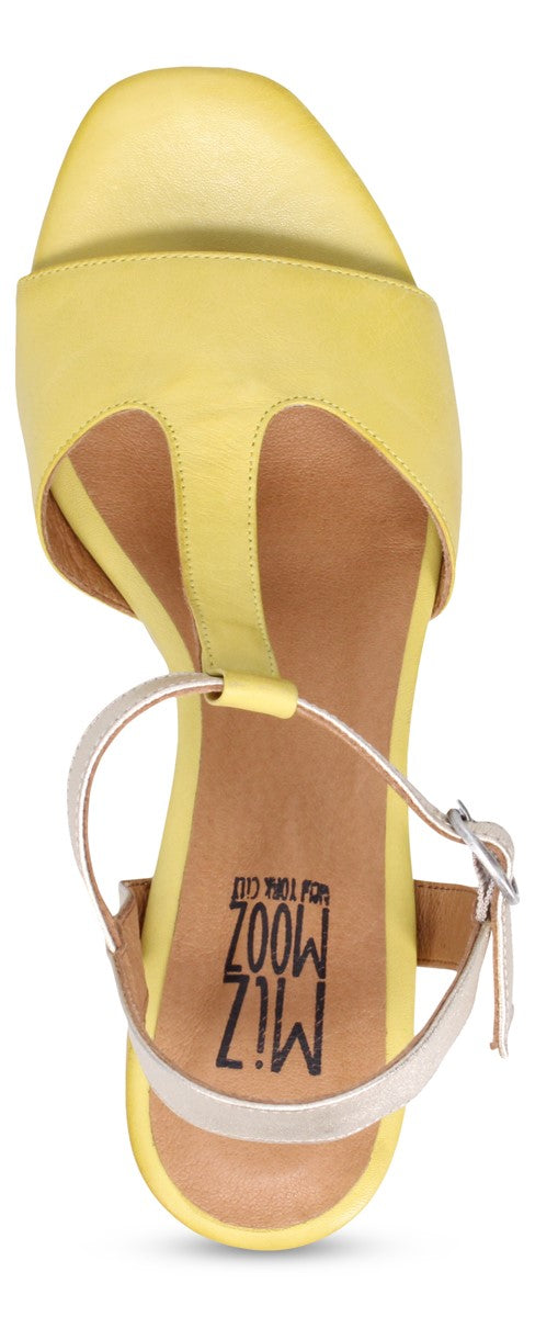 Yellow sandal with a T-strap and silver ankle strap.