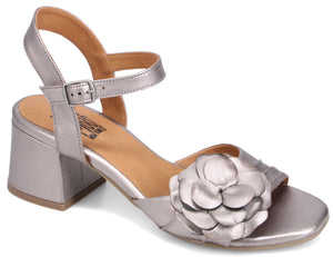 Silver sandal with block heel, ankle strap and flower detail.