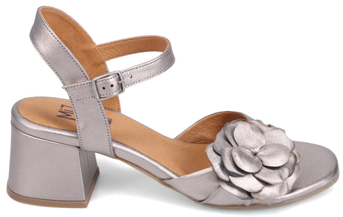 Silver sandal with flower accent and block heel.