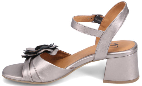 Silver heeled sandal with flower embellishment and ankle strap.