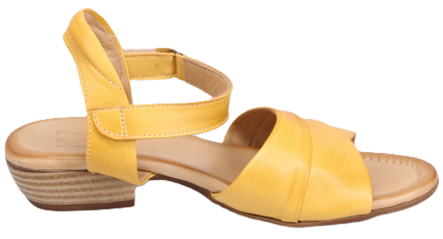 Yellow leather sandal with ankle strap and low heel.