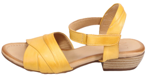 Yellow sandal with criss-cross straps and velcro ankle strap.