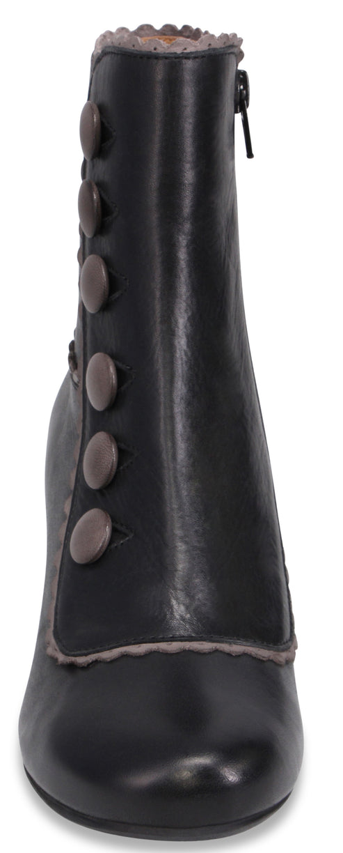 A black ankle boot with a rounded toe, a side zipper, and a vertical row of six brown decorative buttons on the outer side, finished with a grey scalloped trim at the top opening and along the edge of the button panel.