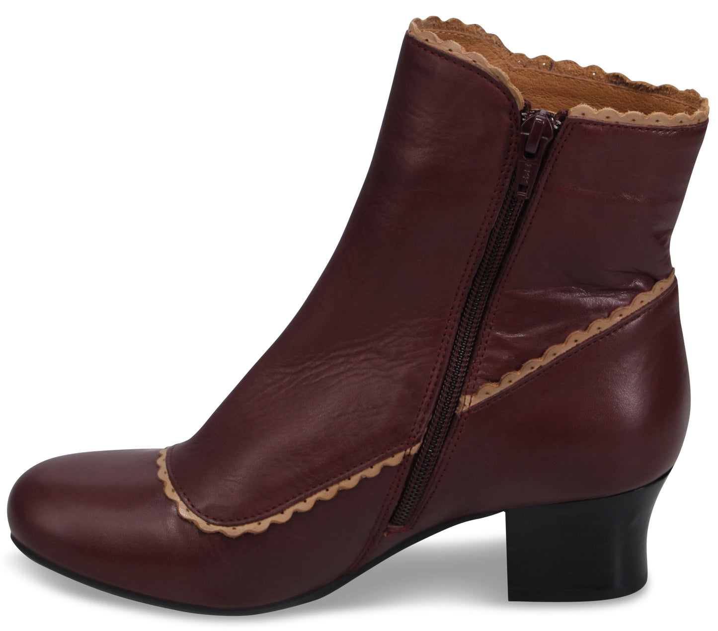 A maroon ankle boot with a rounded toe, a side zipper, and a low block heel, featuring scalloped light-tan trim along the collar and seams.