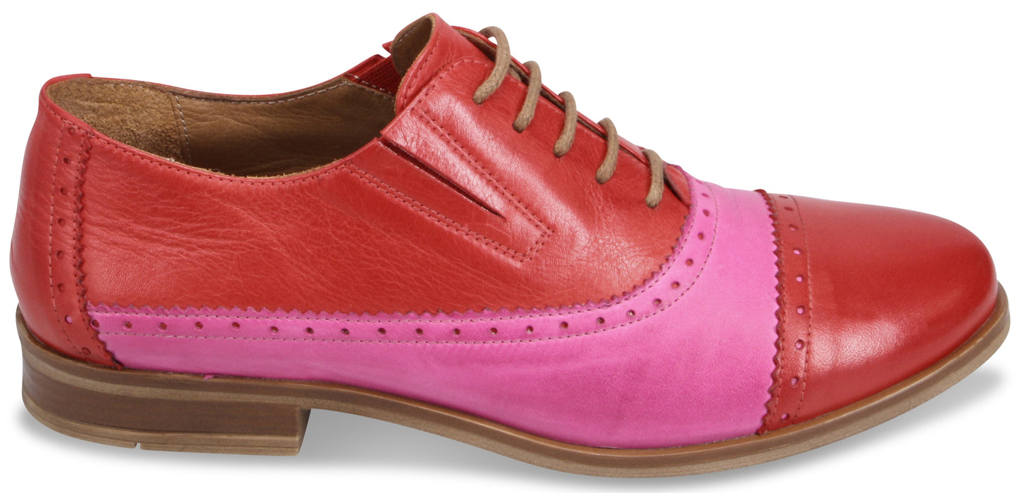 A two-toned, red and pink oxford shoe with brown laces.