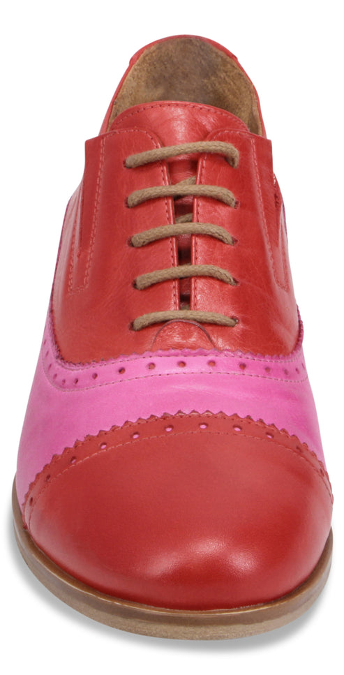 Red and pink cap-toe oxford shoe with brown laces.