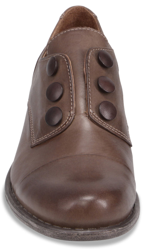A brown leather ankle boot with a rounded toe and six decorative dark brown round buttons arranged in two vertical rows of three along the front closure.