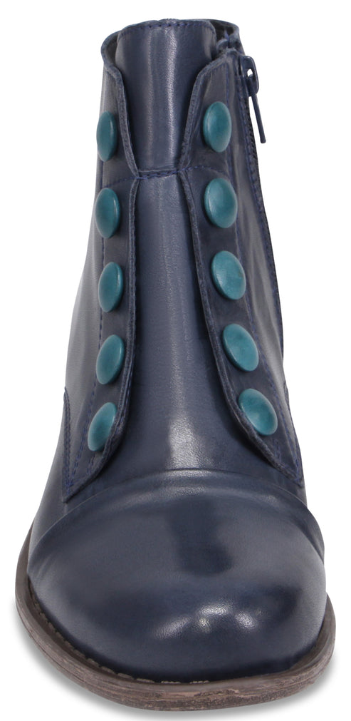 A navy blue leather ankle boot viewed from the front, featuring a row of five decorative teal buttons along each side of the front panel and a side zipper.