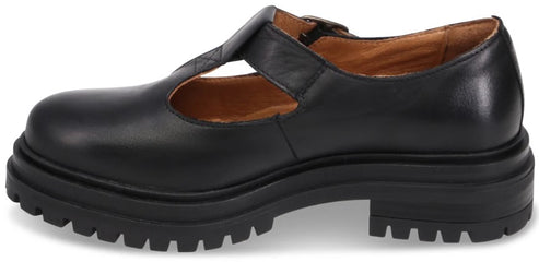 A black leather T-strap Mary Jane shoe featuring a thick, chunky lug sole.