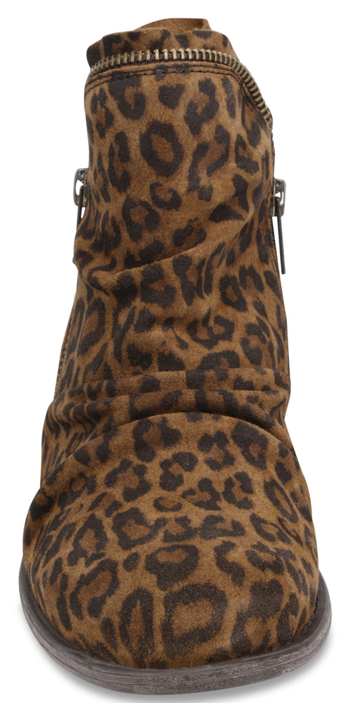 A brown suede ankle boot with a prominent dark brown and black leopard print pattern, featuring a side zipper and a slightly slouched, gathered texture around the shaft.