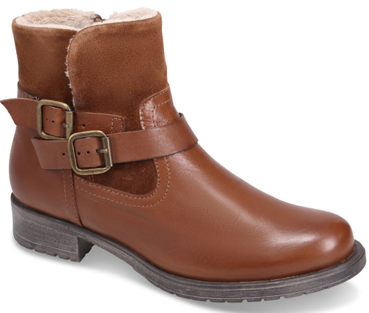 A brown leather ankle boot with a buckle strap, fur lining and a short heel.