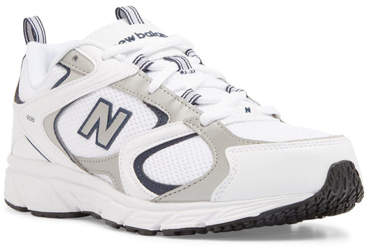 A New Balance 608 athletic sneaker in white with grey and navy blue accents, featuring a prominent N logo on the side, mesh detailing, and a chunky white midsole with a black rubber outsole.