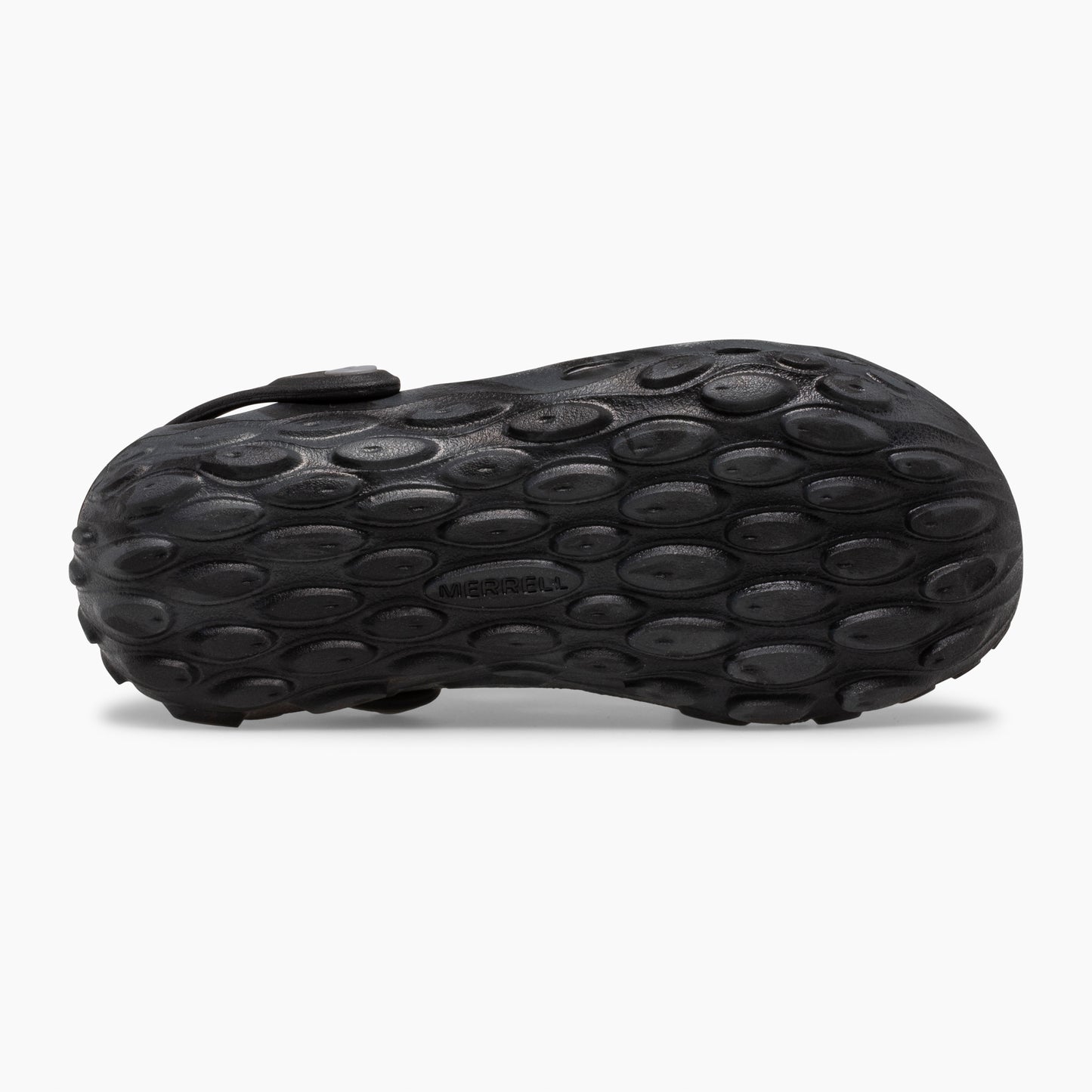 Close-up of a black shoe sole with a textured pebble pattern.