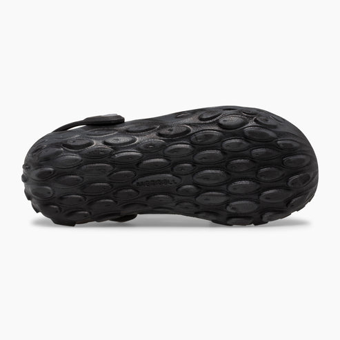 Close-up of a black shoe sole with a textured pebble pattern.