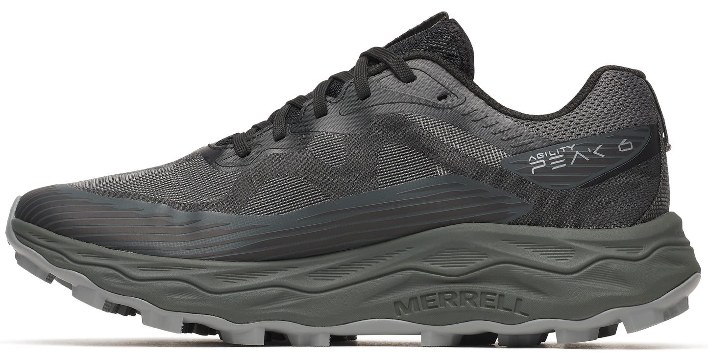 A black trail running shoe with a thick, gray textured sole.
