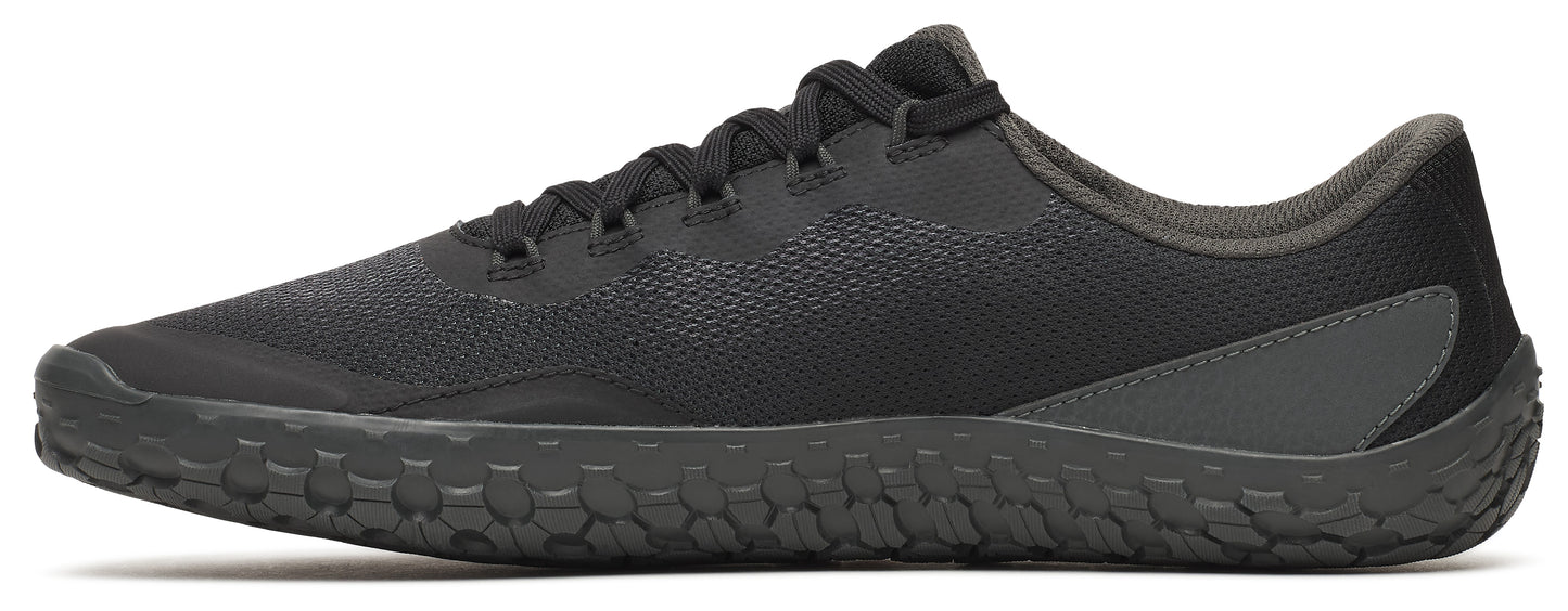 A black sneaker with a textured sole.