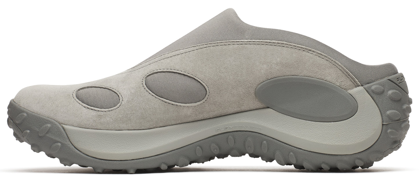 A light gray slip-on shoe with a thick, treaded sole and oval cutouts on the side.