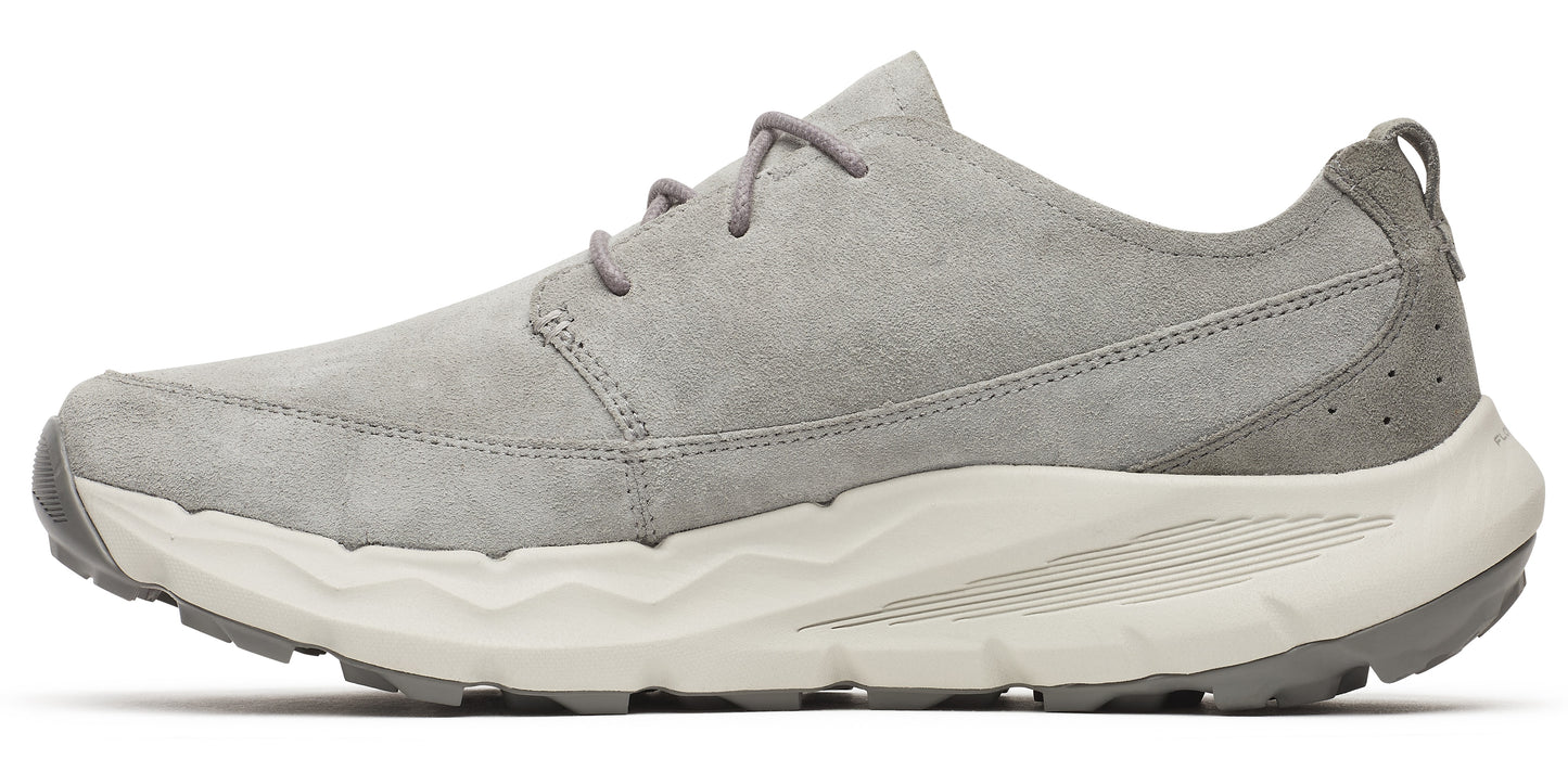 A gray suede shoe with a thick white sole and gray laces.