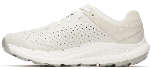 Side view of a white shoe with perforated sides.