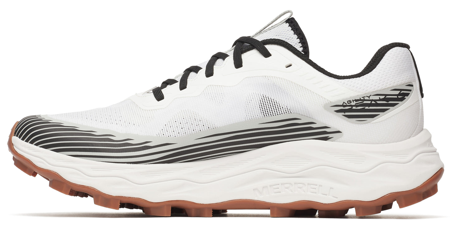 Side view of a white trail running shoe with black laces and brown soles.