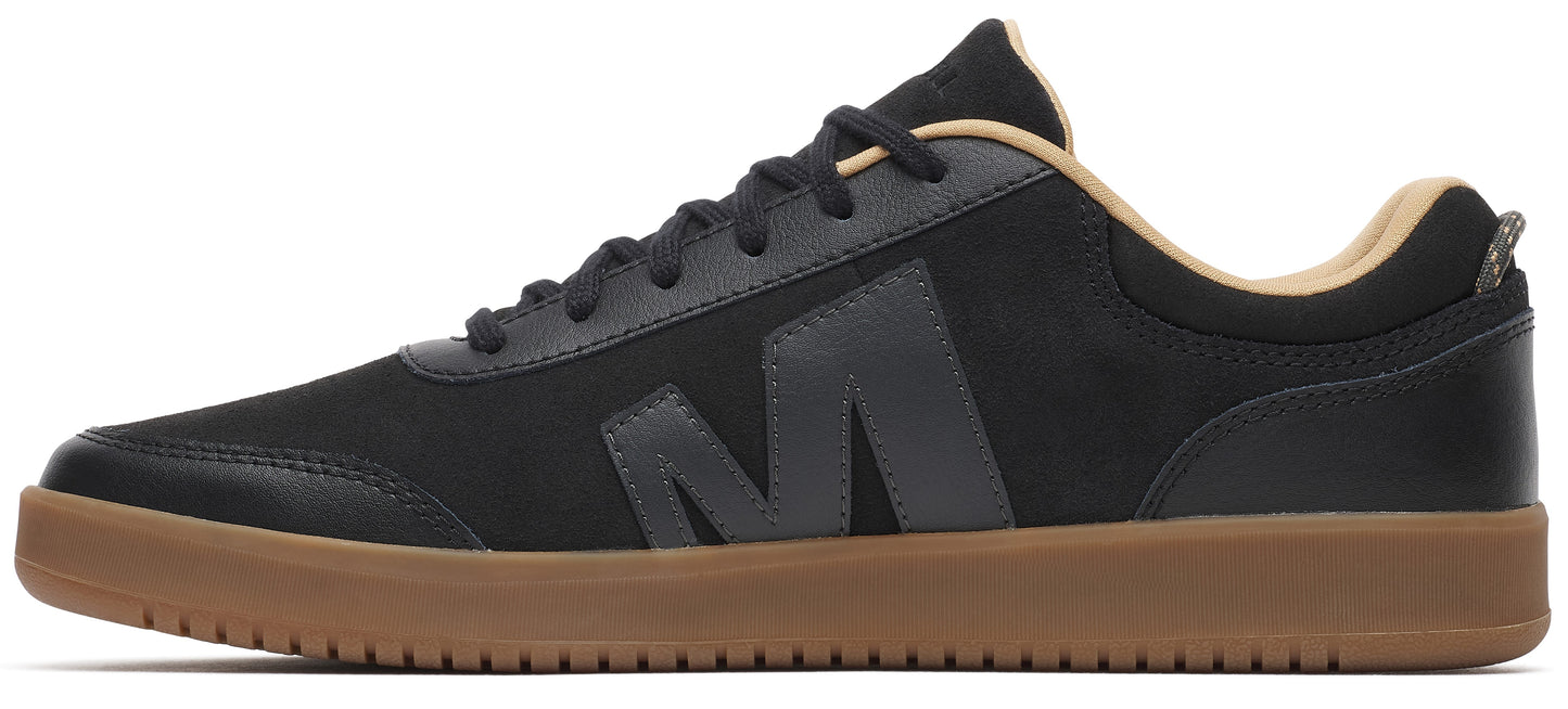 A low-top sneaker with a black upper and a brown sole.