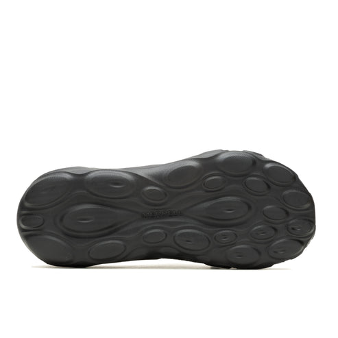 Black shoe sole with oval indentations.