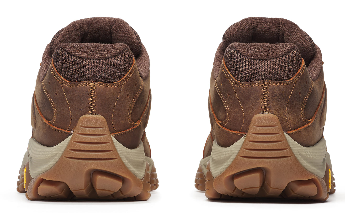 Back view of brown leather walking shoes with thick, lugged soles.