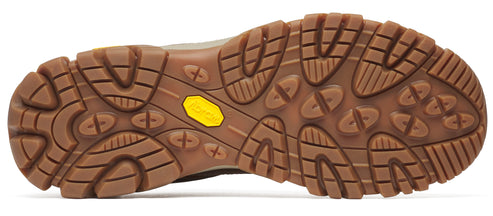 A light brown textured sole of a shoe with deep grooves and yellow rubber inset.