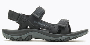 A black sandal with velcro straps and the word "MERRELL" printed on the side.
